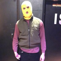 man in yellow skimask