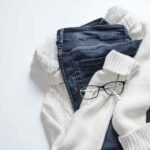 Blue jeans, white socks, and a pair of glasses