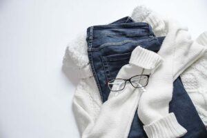 Blue jeans, white socks, and a pair of glasses