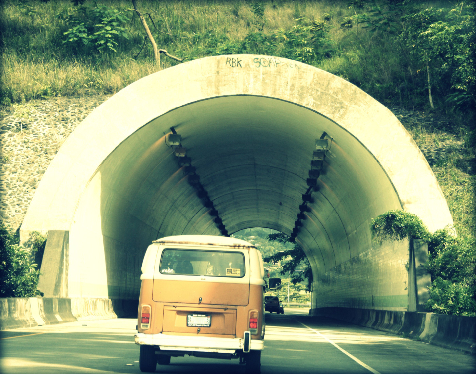 van driving towards tunnel