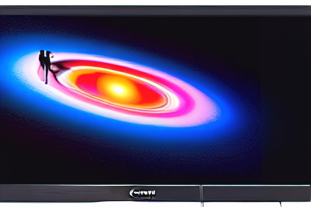 Computer monitor with black hole showing two aliens dancing
